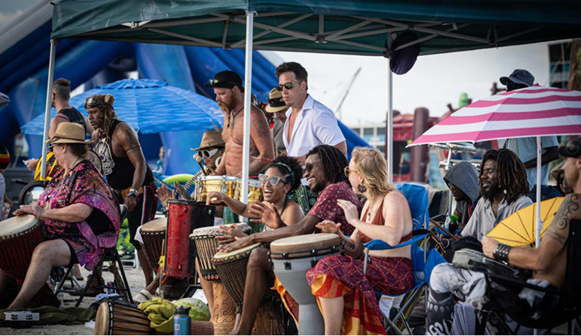 Treasure Island drum circle and beach gathering at sunset