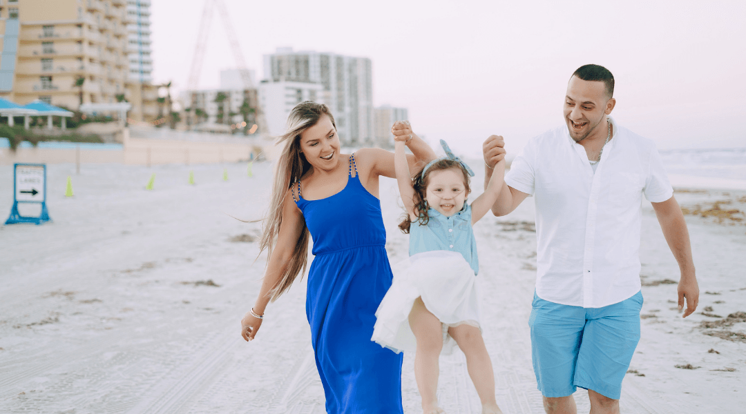 Family walking together on the beach along Florida’s Gulf Coast